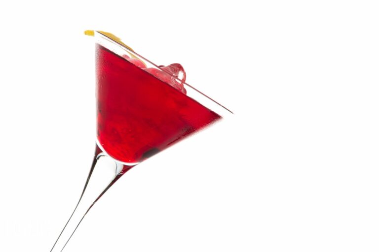 Red cocktail in a martini glass