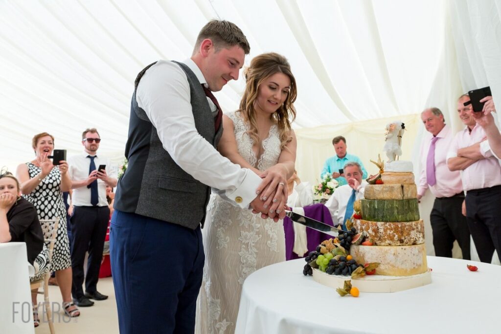 Ally and Alex shunned tradition and opted for a cake made of cheese