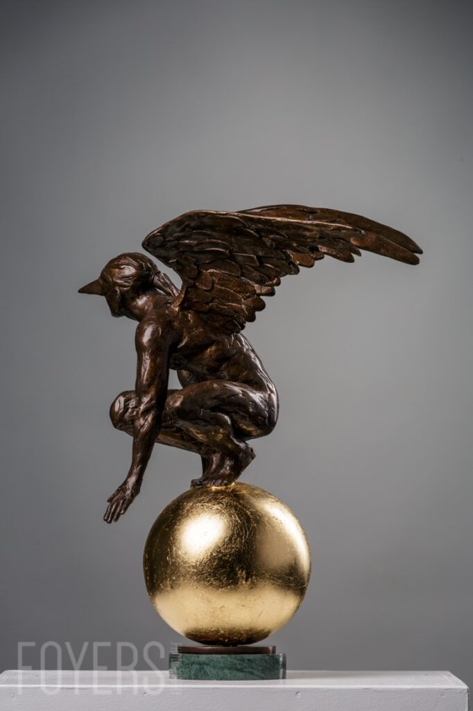 Terra Firma is a portrayal of the beauty and arrogance of man. The figure is modelled crouching on top of the world, dominating his environment. He has conquered technology. The figure’s wings are classically modelled and the beauty of the male form finely accentuated.
