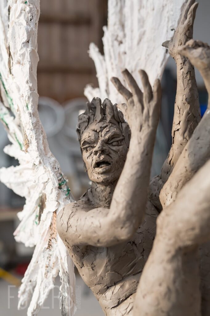 Lost Wax is the maquette I first made to allow me to develop my ideas for Icarus. Unlike Icarus, whose wings were modelled using plaster to give strength, in Lost Wax I have made the wings with wax, over a structure of wire mesh and metal rods. Again. the circle in which he is suspended is gold leafed and the figure is patinated with a green hue. The title of the piece is an irresistible pun on the Icarus story and the casting process which uses the lost wax method.