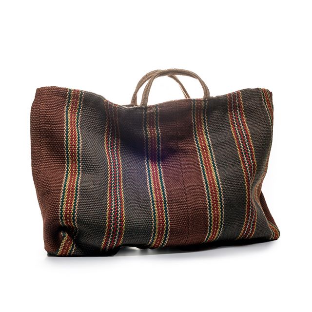 A striped canvas tote bag in brown, charcoal and burgundy with rope handles, displayed against a white background.
