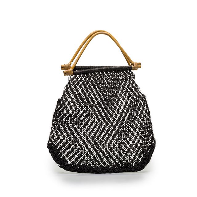 Black mesh shoulder bag with diagonal woven pattern and curved wooden handles, displayed against a white background.