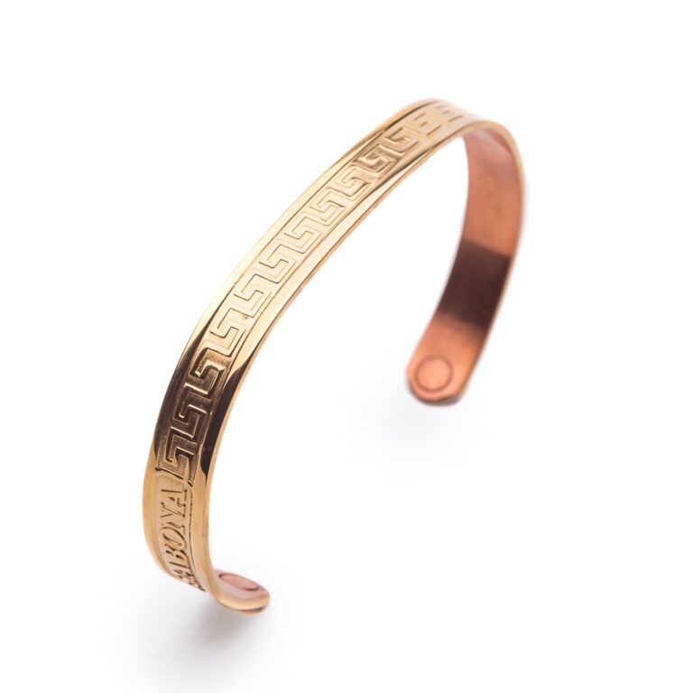 A copper cuff bracelet with a Greek key pattern engraved around the band, displayed against a white background.