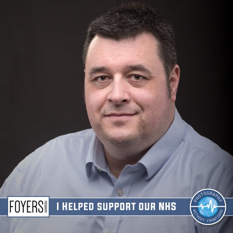 A man in a grey shirt against a dark background. Text reads I HELPED SUPPORT OUR NHS with Foyers and Photography Without Frontiers logos.