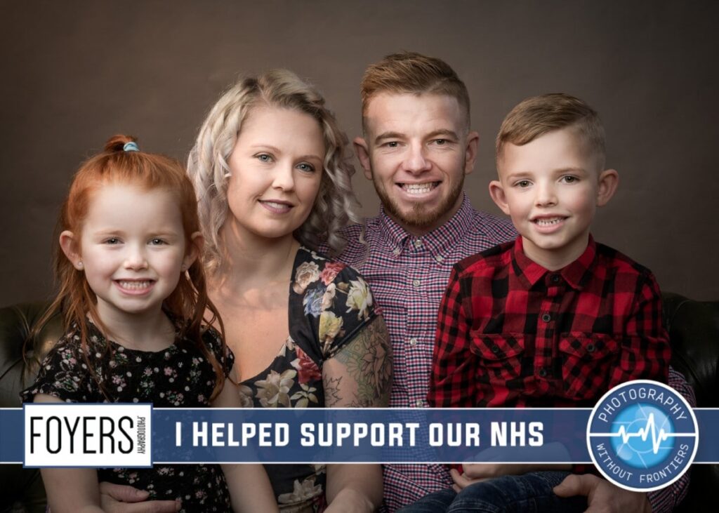 Family of four smiling at camera against brown backdrop. Text reads I helped support our NHS with Foyers and Photography Without Frontiers logos.