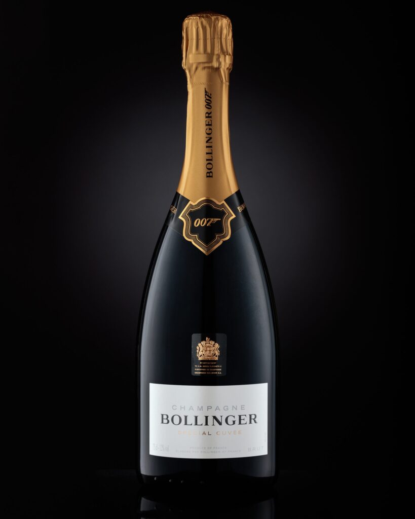 An expertly composed photograph capturing the elegance of a James Bond 007 Bollinger champagne bottle, with a sophisticated backdrop enhancing its luxurious appeal, photographed at Foyers Photography Studio, Bentwaters, Suffolk.