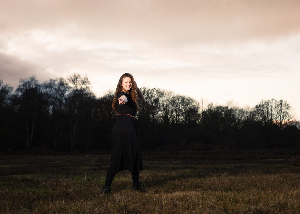 Isabelle posing for a portrait while modelling outdoors