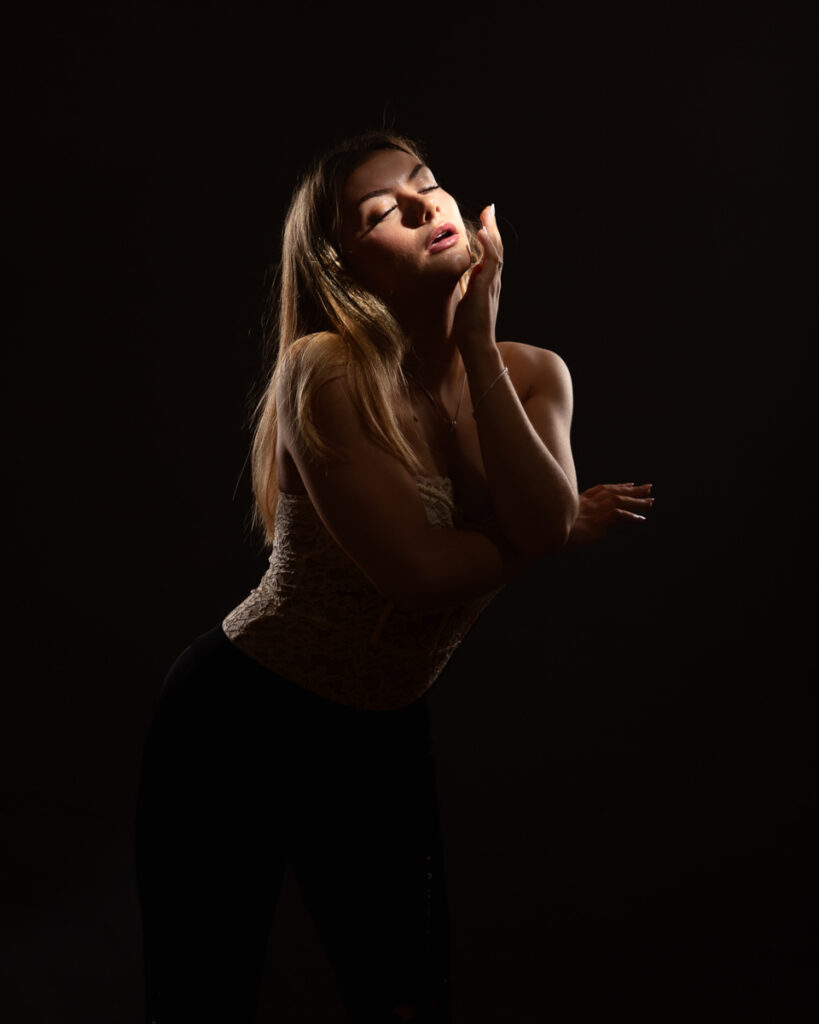 Woman posing in dramatic lighting