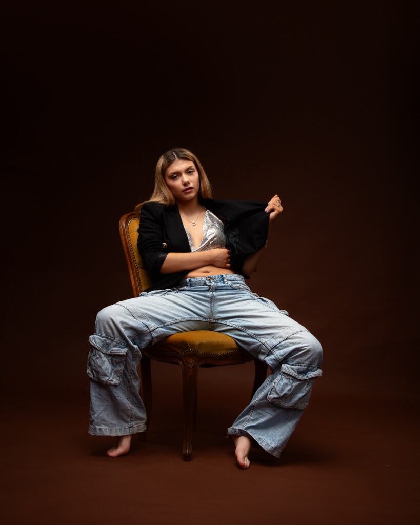 Woman sitting stylishly on chair