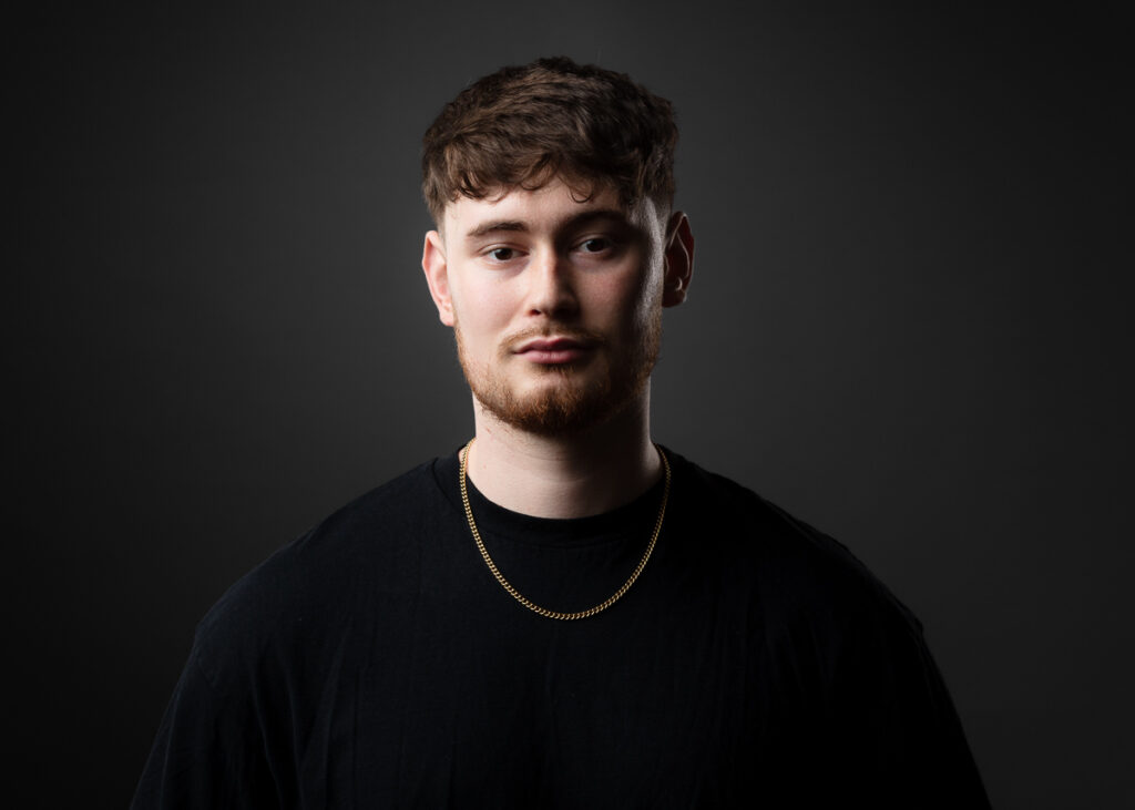 Young man with short hair and beard.