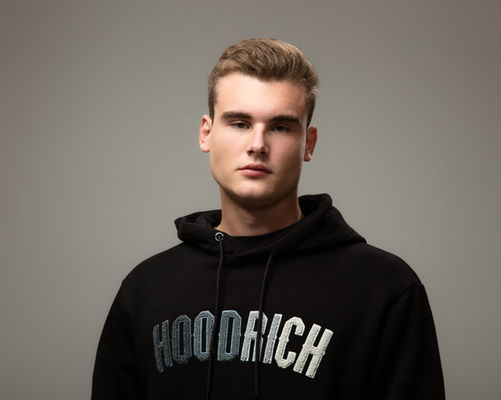 Person wearing black HOODRICH hoodie.