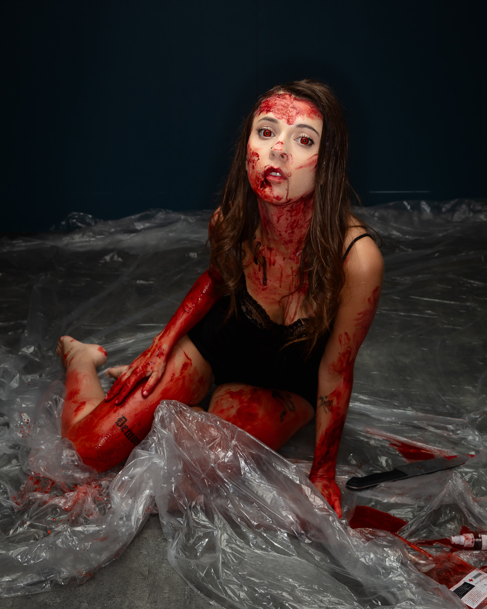 Woman with theatrical blood makeup and special effects prosthetics