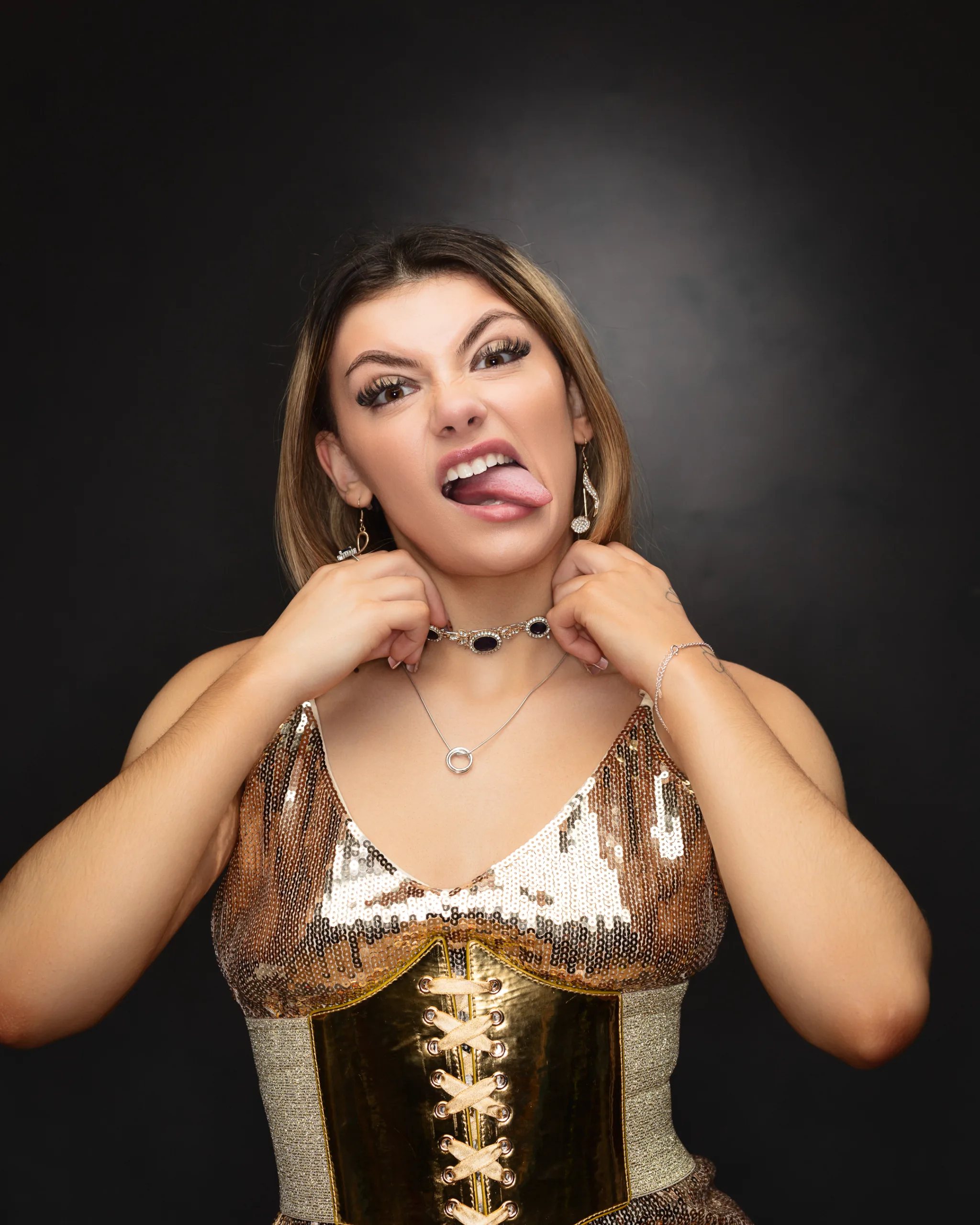 Woman making funny face with tongue out.