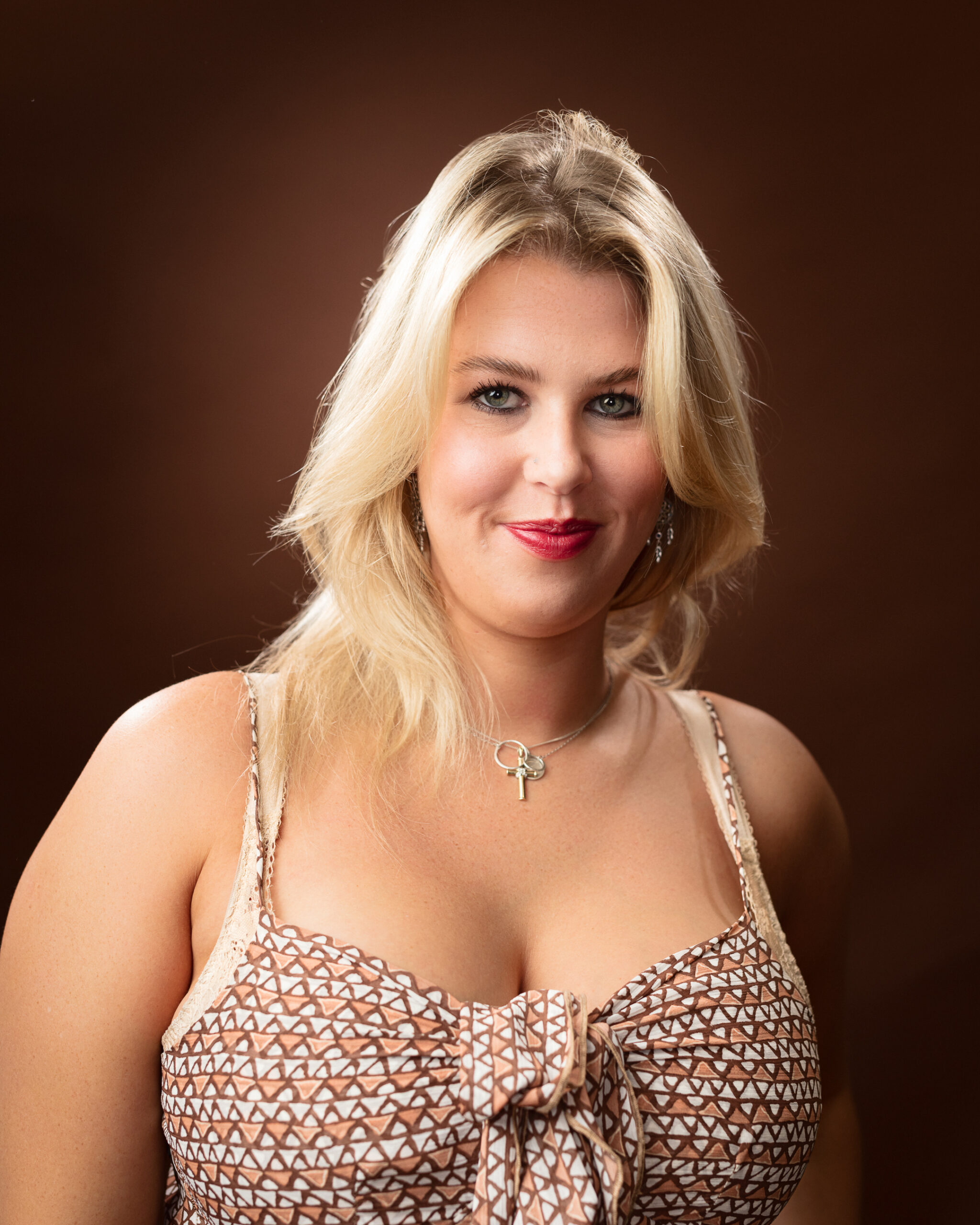 Woman with blonde hair smiling.