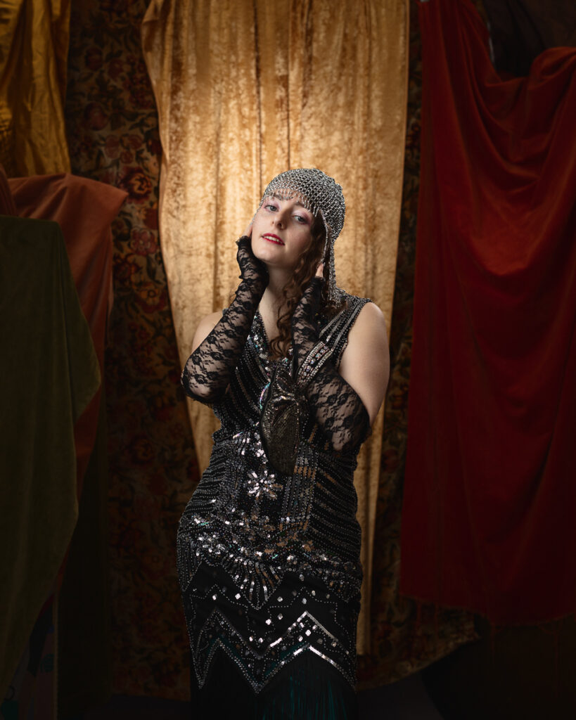 Woman in vintage evening dress with lace gloves