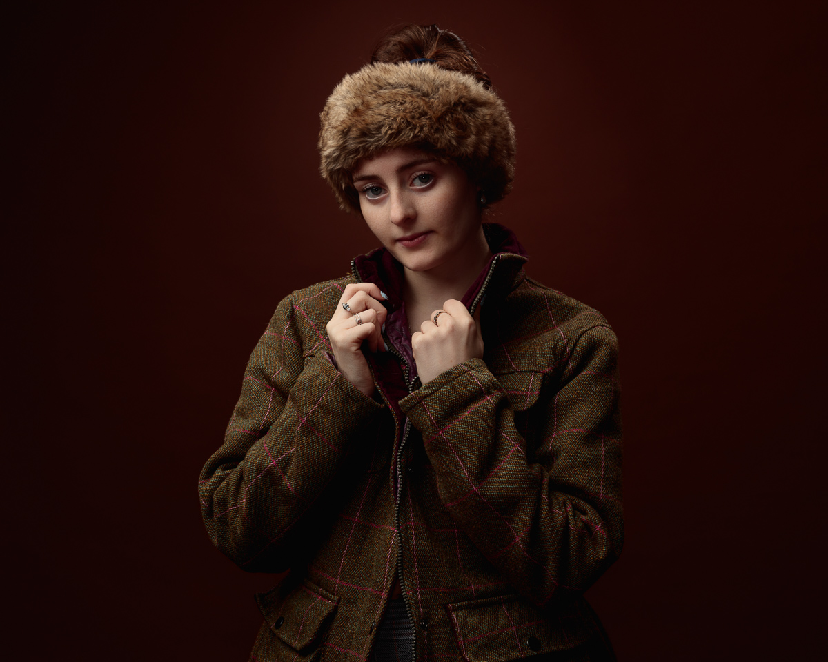 Woman in jacket with fur headband
