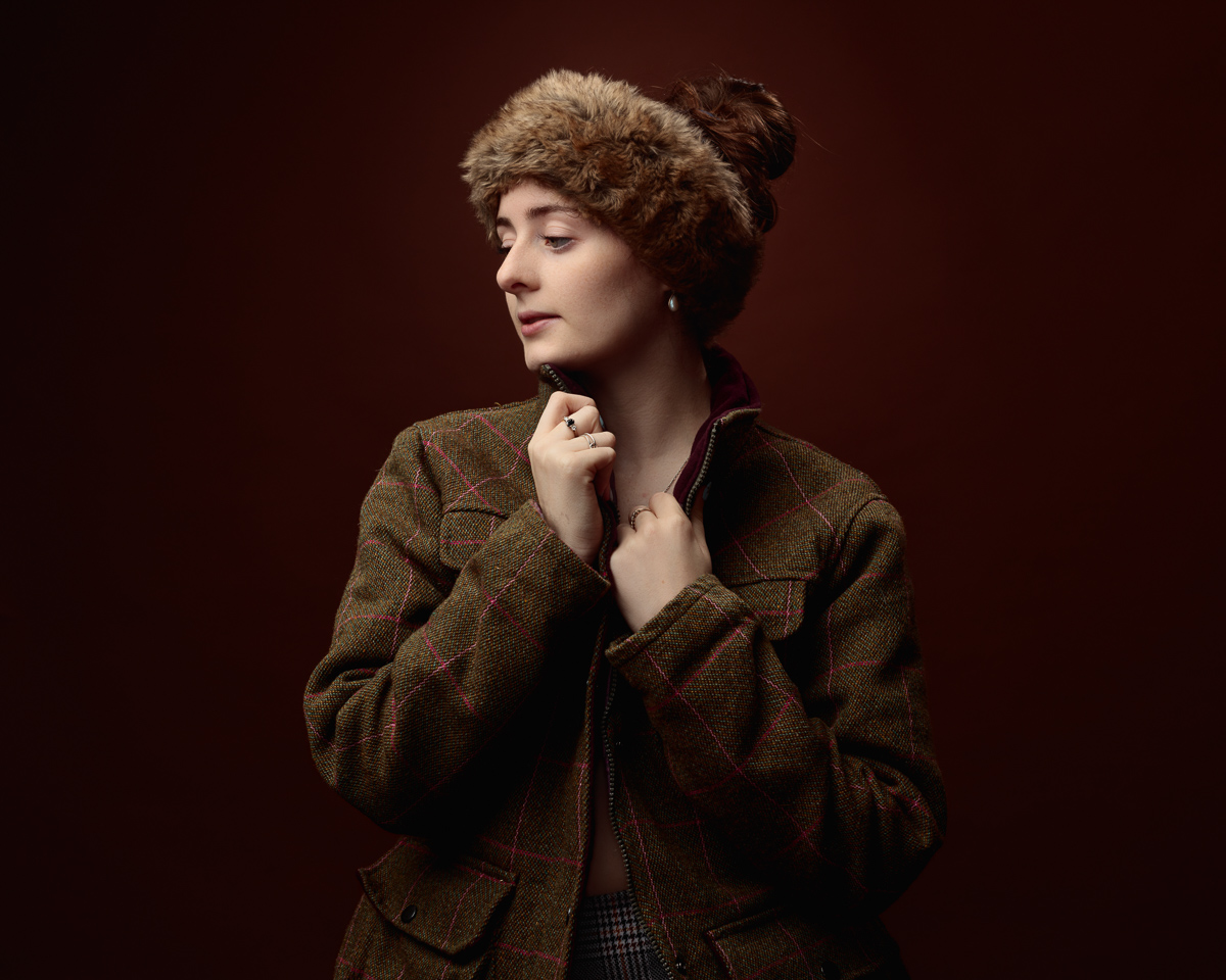 Woman in tweed jacket and fur hat portrait