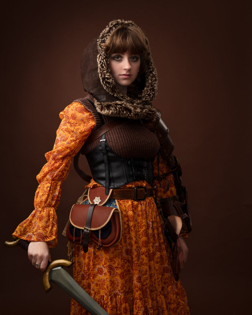 Person with sword in medieval costume.