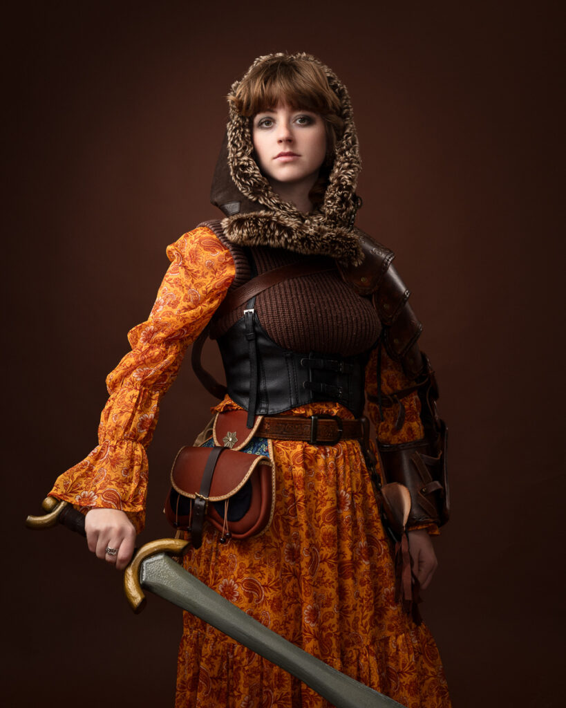 Woman in medieval costume holding a sword