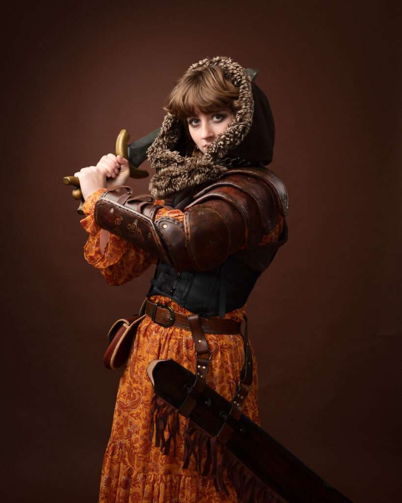 Medieval warrior woman in armour and dress