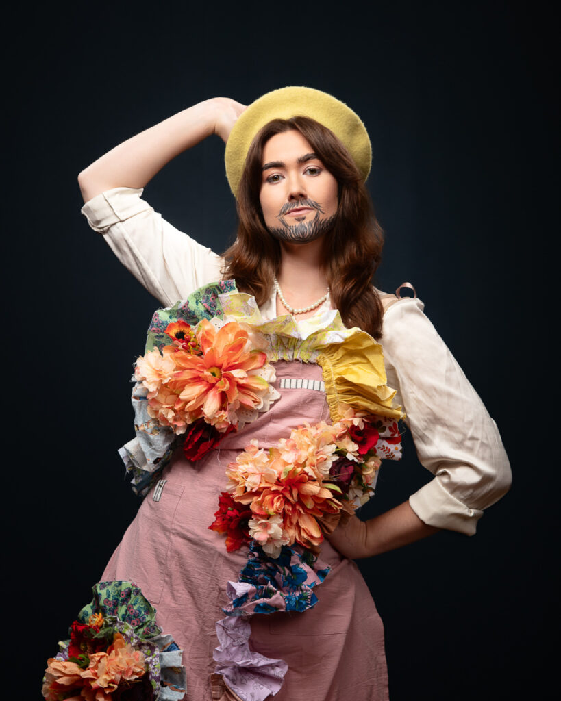 Person in floral attire posing confidently.