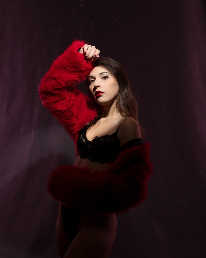 Person posing in red fur jacket