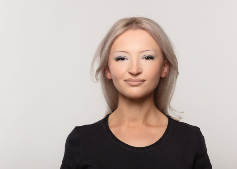 Woman smiling in black top portrait