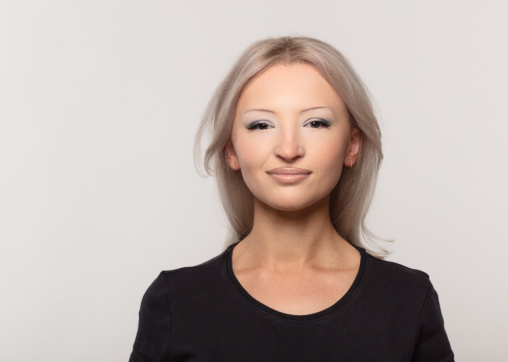 Woman smiling in black top portrait