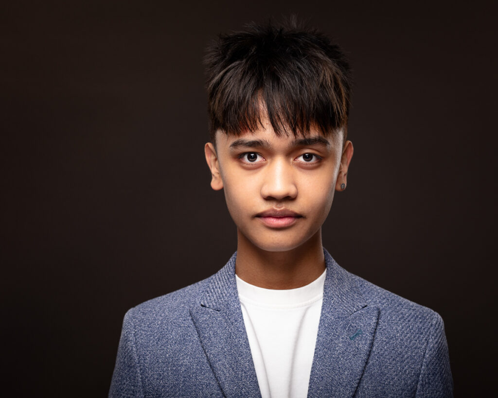 Young person in blue blazer portrait