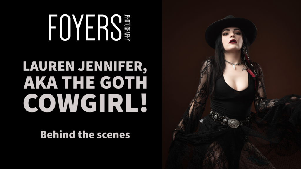 Goth cowgirl in black lace outfit and hat