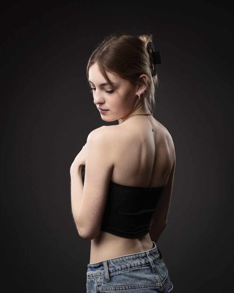 Woman in black top and jeans