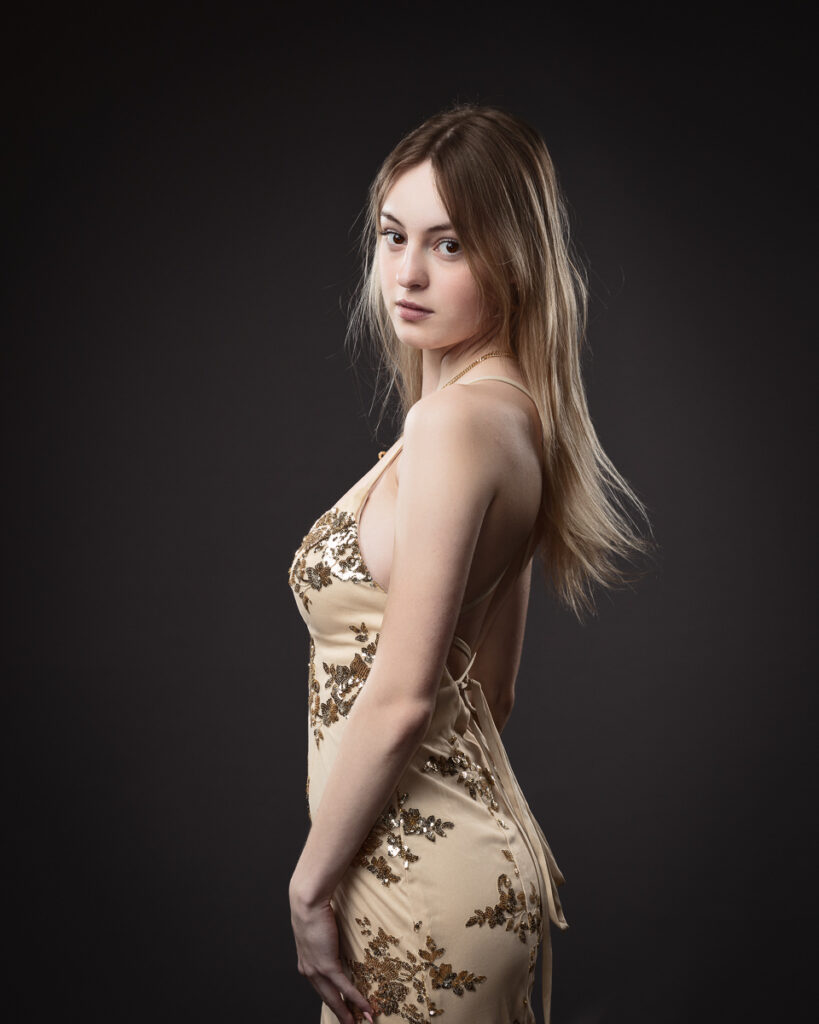 Person in elegant dress, looking over shoulder