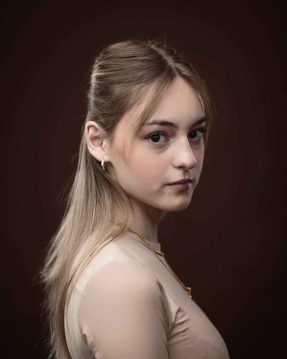 Woman with long hair and thoughtful expression