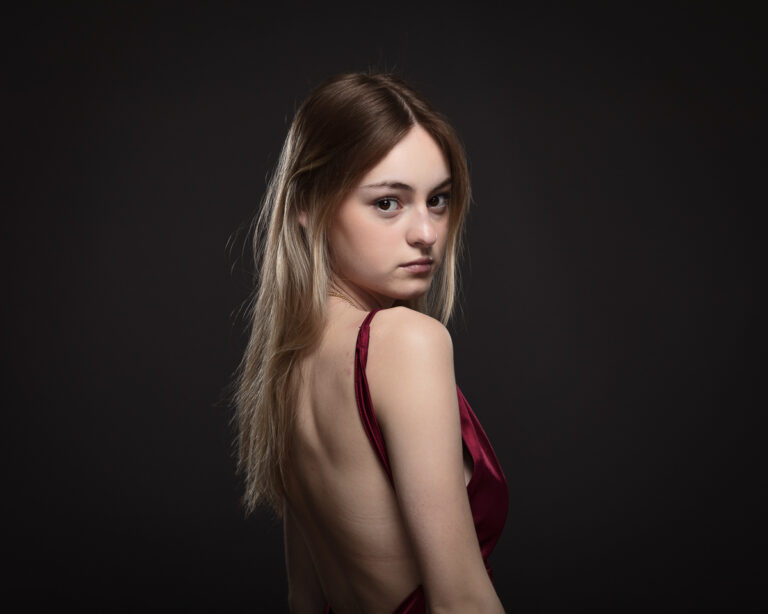 Woman in red dress with open back