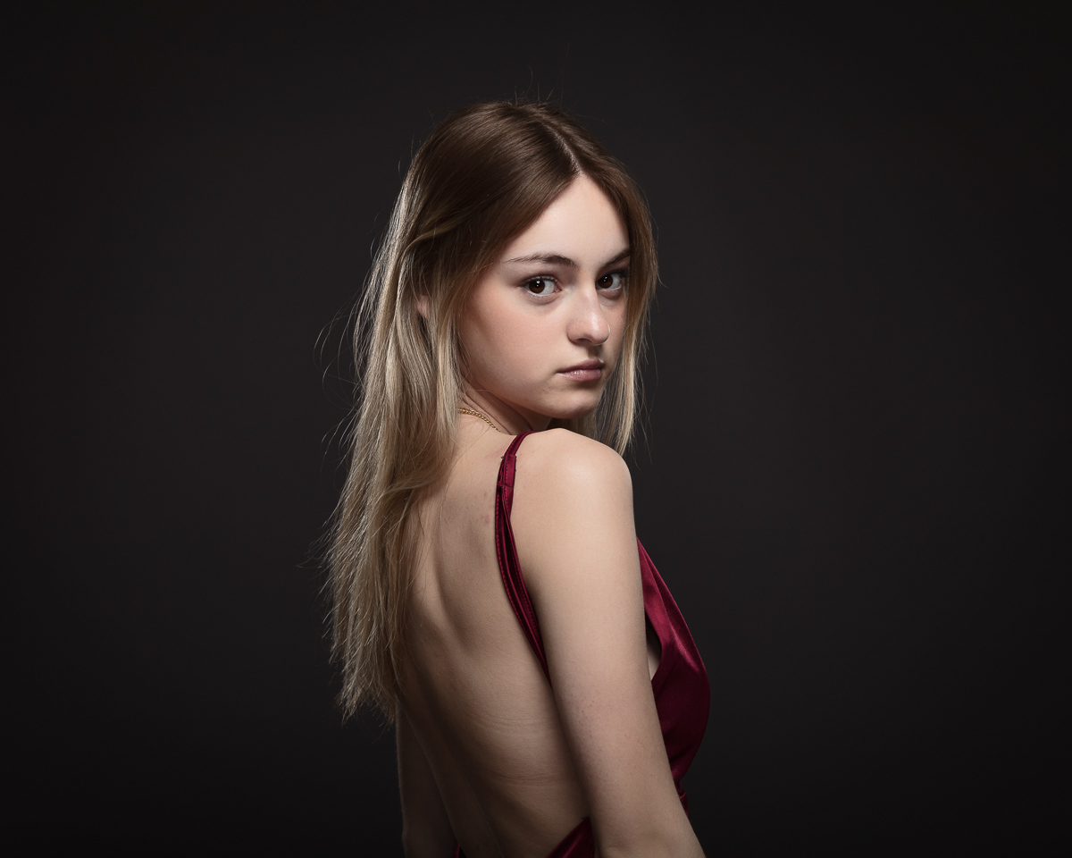 Woman in red dress with open back