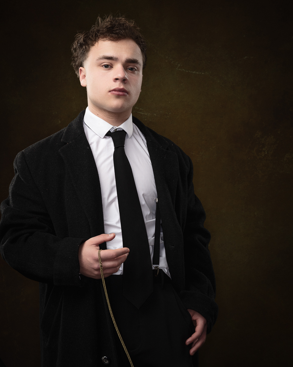 Man in suit with tie and coat portrait