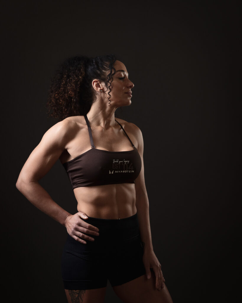 Athletic woman posing in sports attire.