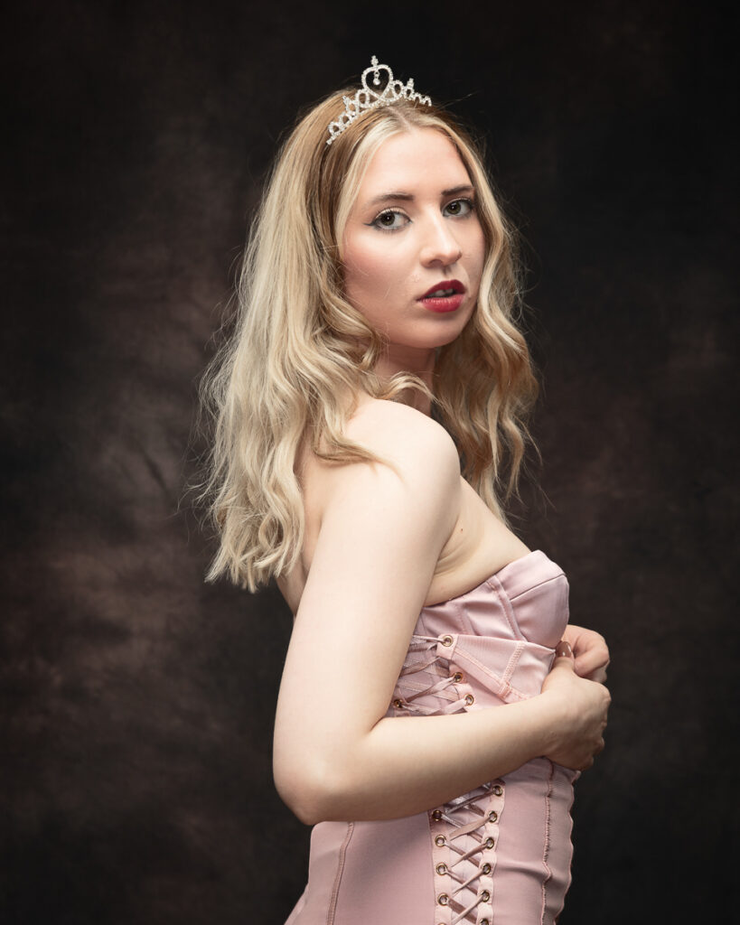 Woman in pink dress with tiara