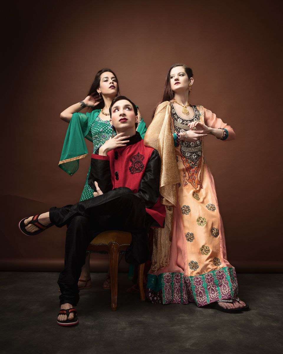 Three models in colourful traditional Indian attire.