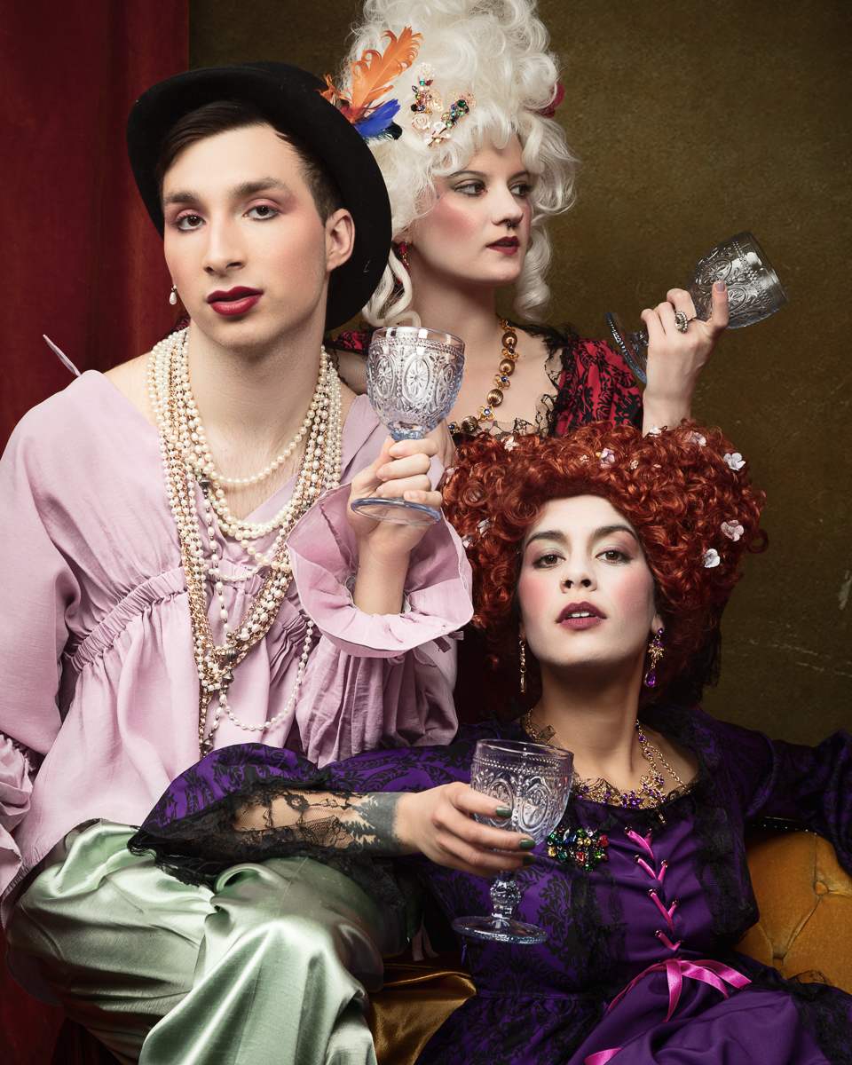 Theatrical group in vintage costumes and makeup.