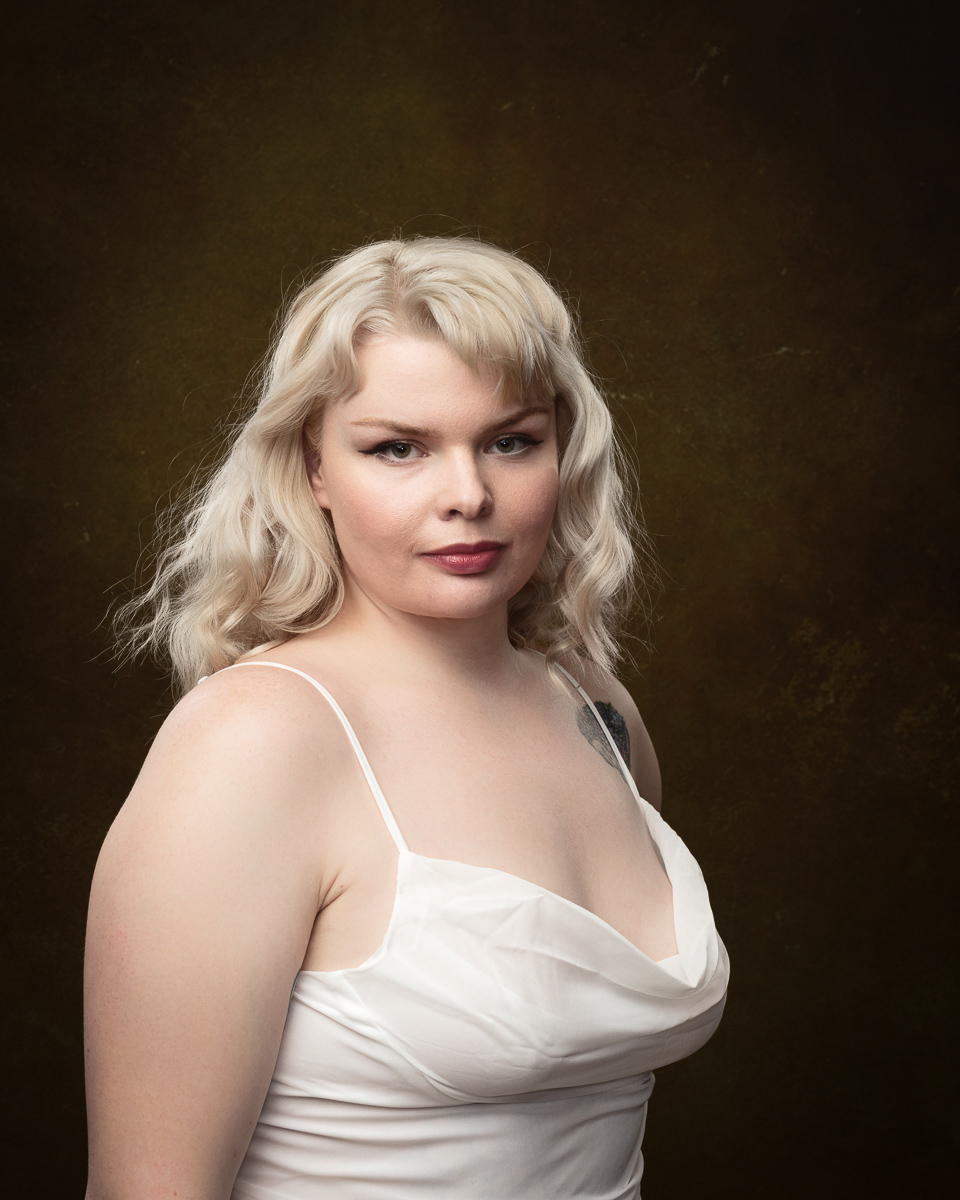 Woman in white dress with background.