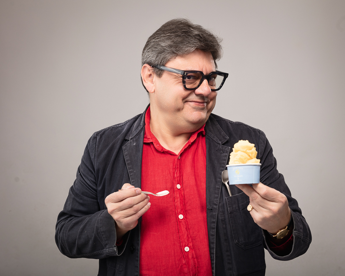 Man in red shirt holding ice cream