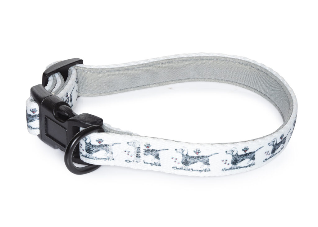 White dog collar with dachshund design and black buckle.