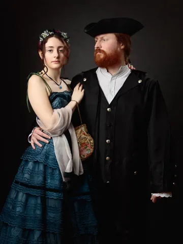 two people in historic costumes