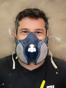 Man wearing protective face mask indoors