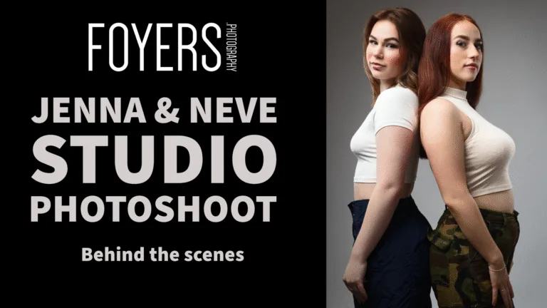 Two women in a studio photoshoot, back to back.