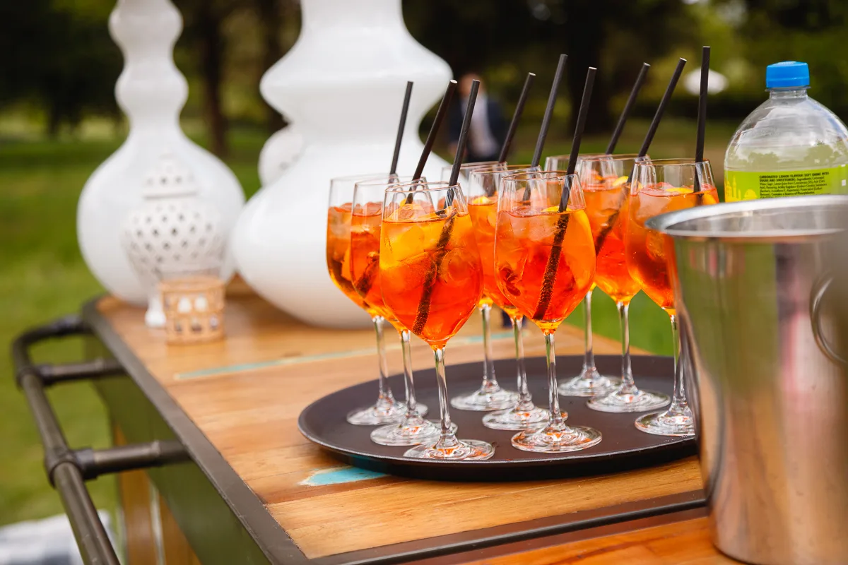 Glasses of orange cocktails on outdoor table