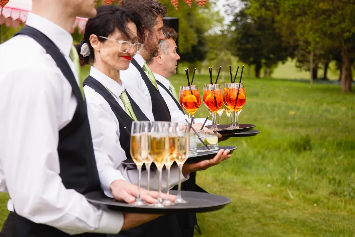 Waiters serving drinks at outdoor event