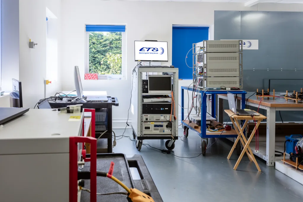 Electromagnetic testing laboratory with equipment and computers.