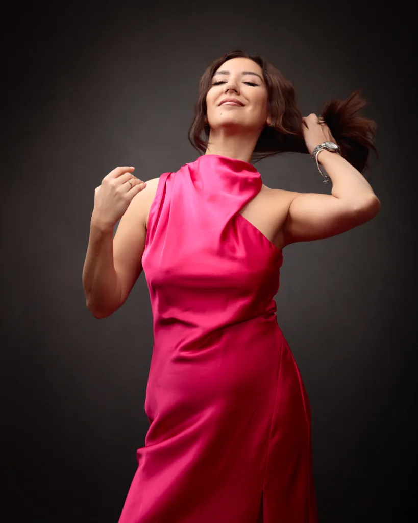 Confident woman in elegant pink dress